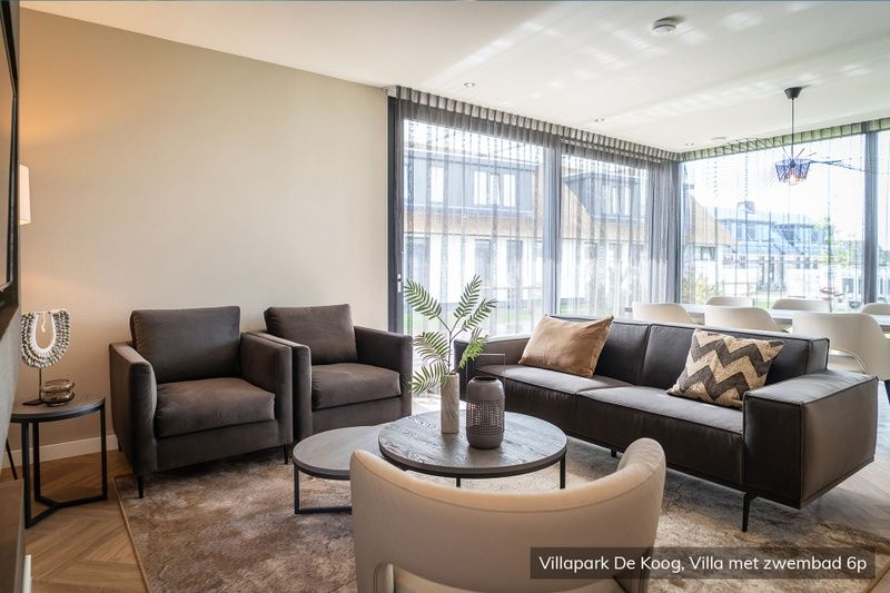 Luxury family villa with pool in De Koog, Texel. Cozy sitting area with modern decor in the Wadden Islands.