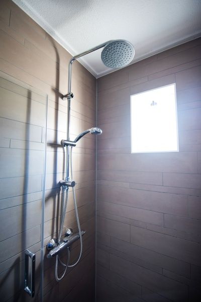 Modern shower in Villa 3, vacation home De Koog Texel, with stylish finish.