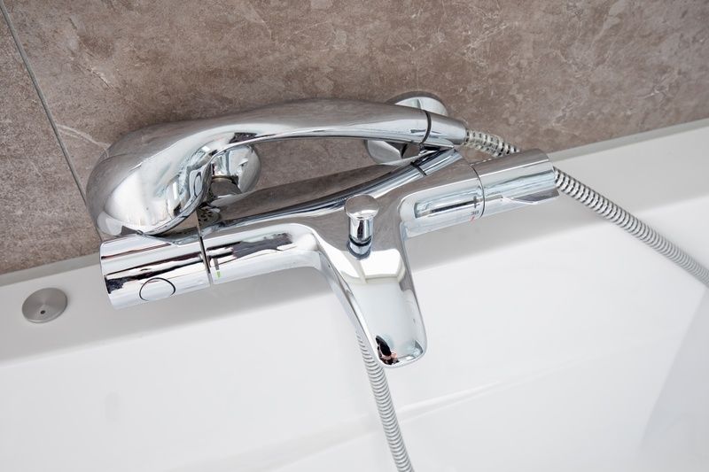 Stylish faucet in Villa 3, vacation home De Koog Texel, with modern bathroom design.