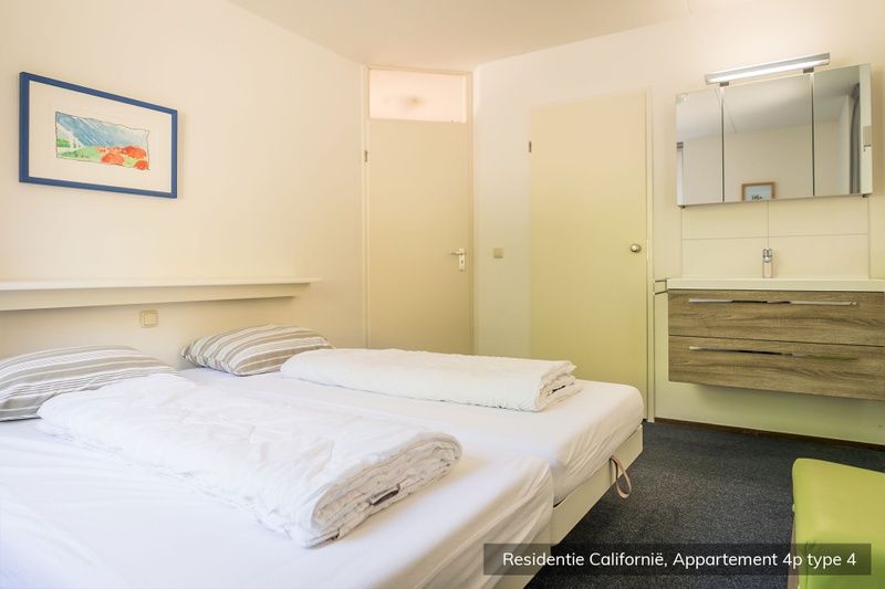 Comfortable bedroom in Type 4 vacation home, De Koog, Texel. Restful atmosphere with soft colors.