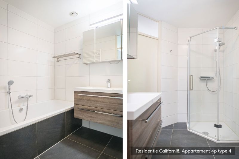 Modern bathroom in Type 4 vacation home, De Koog, Texel. Equipped with bathtub and separate shower.