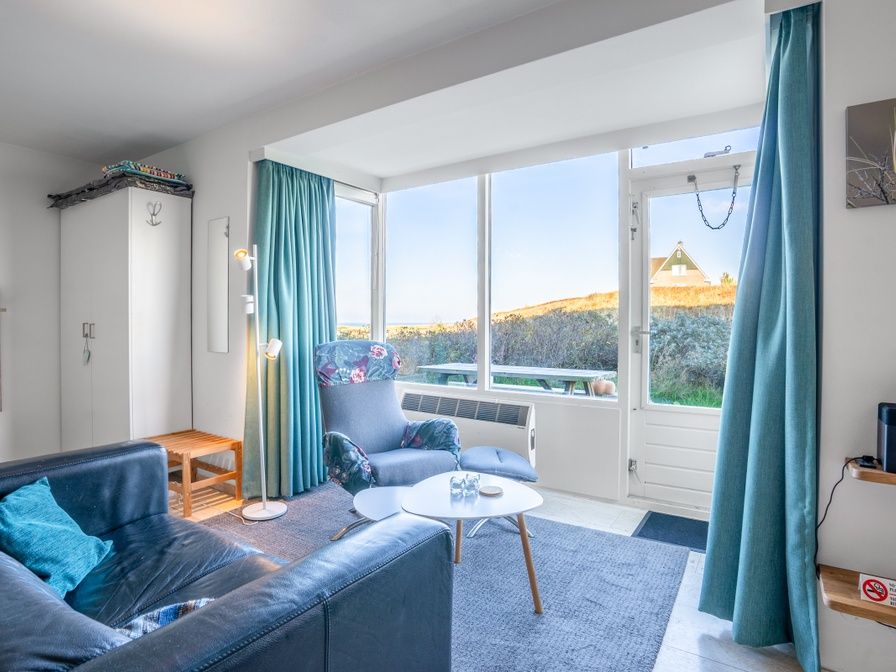 Cozy living room in Apartment Juliana 068 Island and Sea View, De Koog, Texel with beautiful views of the dunes.