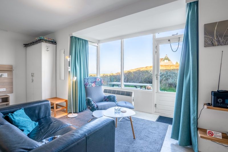 Bright interior space of Apartment Juliana 068 Island and Sea View, De Koog, Texel with comfortable seating.