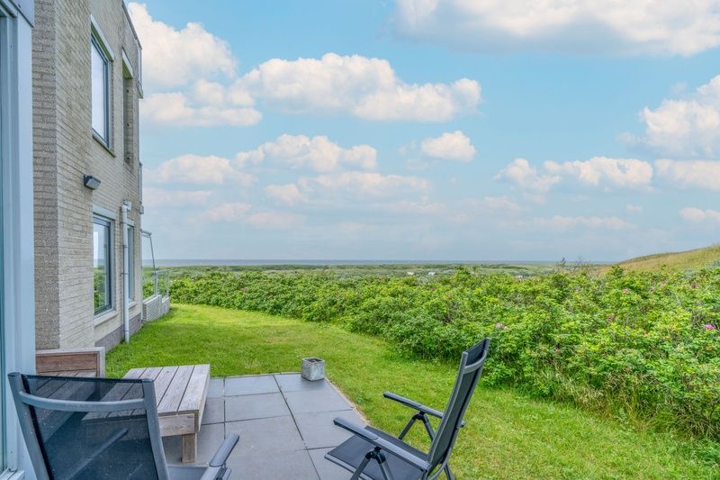 Terrace of Apartment Juliana 068 Island and Sea View, De Koog, Texel overlooking nature.