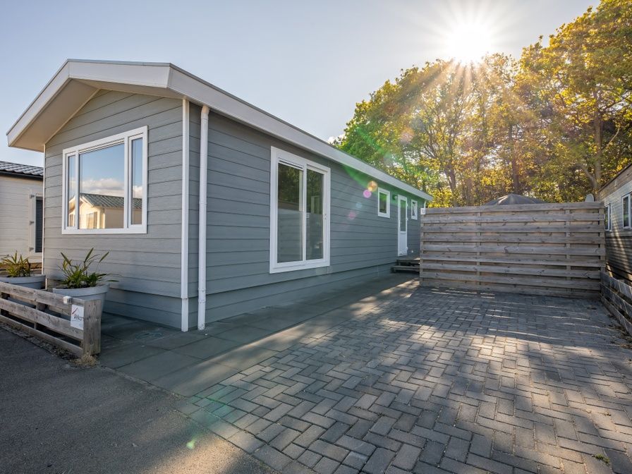 Chalet Bregkoog 12 in De Koog, Texel offers a modern exterior with ample parking in the Wadden Islands.