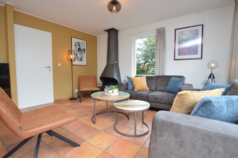 Gemuetliche Sitzecke mit Kamin im Ferienhaus Stappeland 169, De Koog Texel.