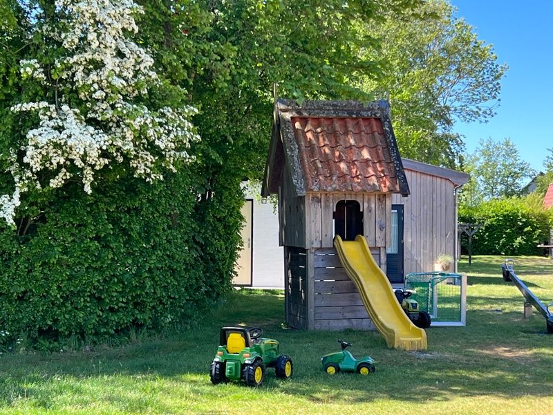 Fun playground at Landgoed Springtij - Koetshuis 2, vacation home in De Koog, Texel, perfect for children to enjoy.
