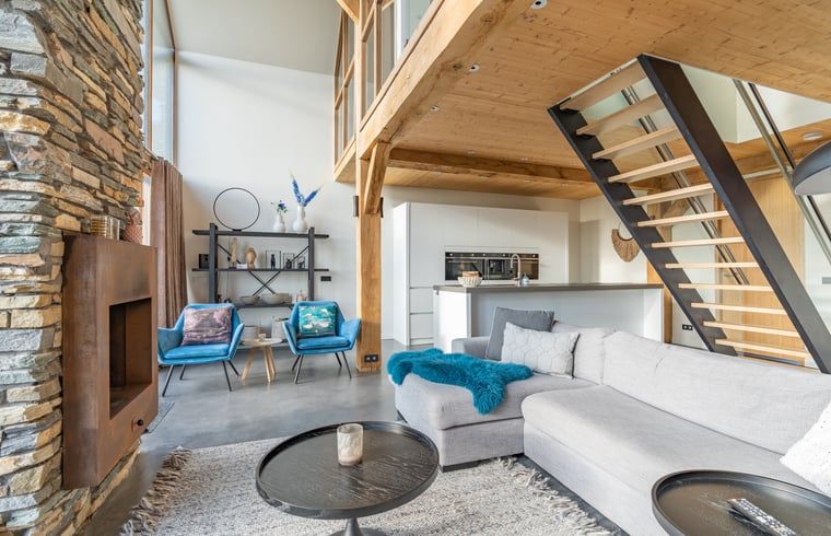 Stylish living room with open kitchen in Holiday home in De Koog Texel, ideal for a relaxing vacation on the Wadden Islands.