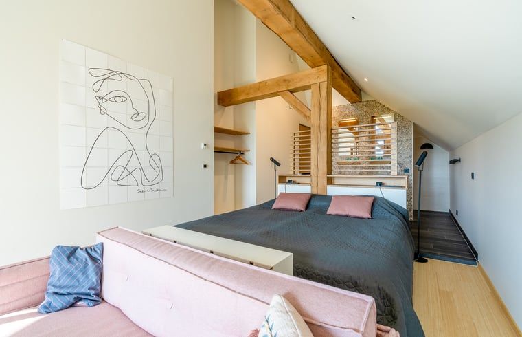 Stylish bedroom with art on the wall in Holiday home in De Koog Texel, for an artistic stay on the Wadden Islands.