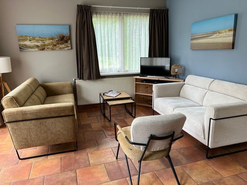 Cozy living room in Landgoed Springtij - Koetshuis 1, vacation home in De Koog, Texel.