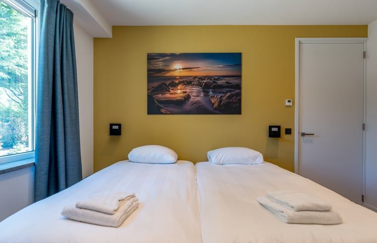 Gemuetliches Schlafzimmer unter dem Dach des Ferienhauses in Den Burg, Texel.