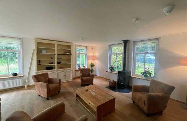 Bright and spacious living room in Cottage in Den Burg, Texel, perfect for relaxation.