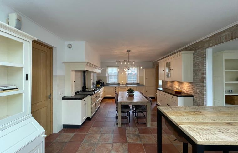 Spacious dining kitchen in cottage in Den Burg, Texel, ideal for cozy meals with the family.