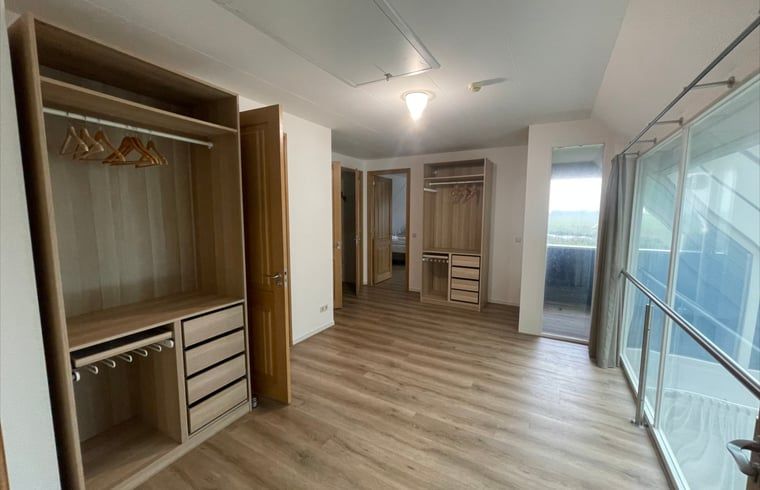 Walk-in closet in Cottage in Den Burg, Texel, lots of storage space for an organized stay.