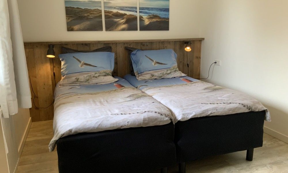 Stylish bathroom in family Smit bungalow Den Burg Texel with modern amenities.