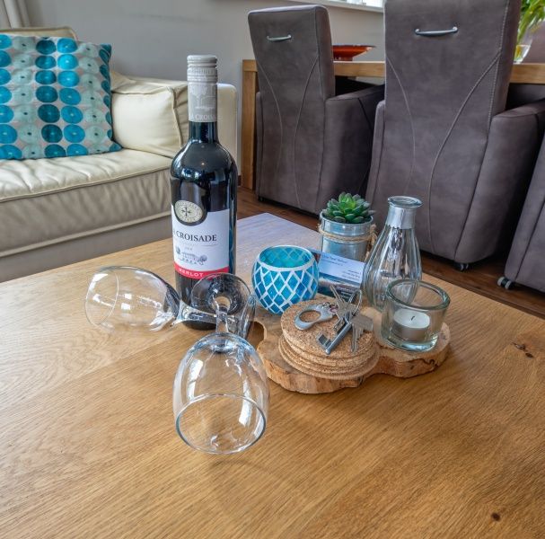 Stylish decor in Villa 3C, Den Burg, Texel, with wine and glasses on the coffee table, luxury vacation home.