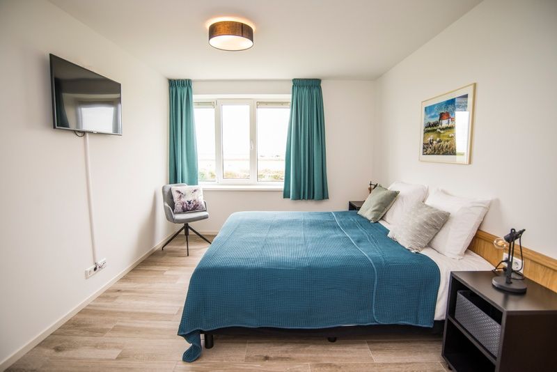 Comfortabele slaapkamer in Onder de Wol Den Burg, Texel met prachtig uitzicht.