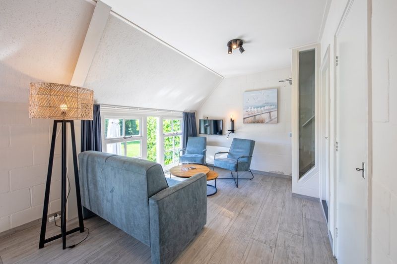 Gezellige woonkamer in Appartement Gouden Reaal 25, Den Hoorn Texel, vakantiehuis met comfortabele zitplekken op de Waddeneilanden.