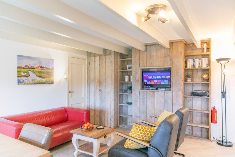 Cozy living room of Apartment Hof, Den Hoorn, Texel, with comfortable seating area.