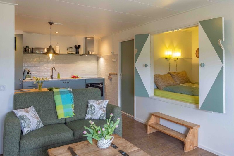 Modern kitchen and living space in Apartment Green, vacation home in Den Hoorn, Texel, with comfortable amenities.