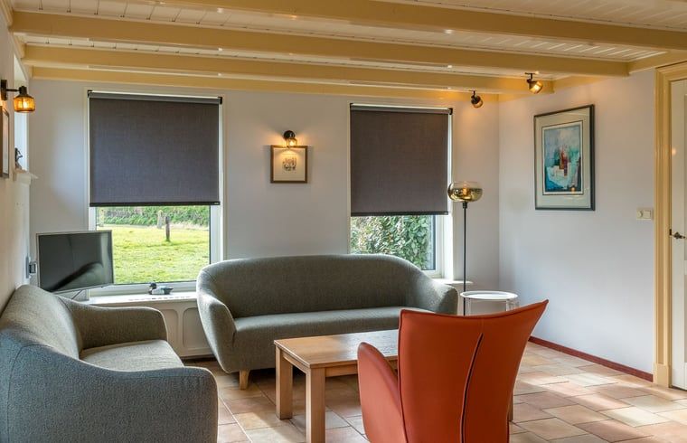 Sunny sitting area in Holiday home in Oosterend, Texel, overlooking the garden.