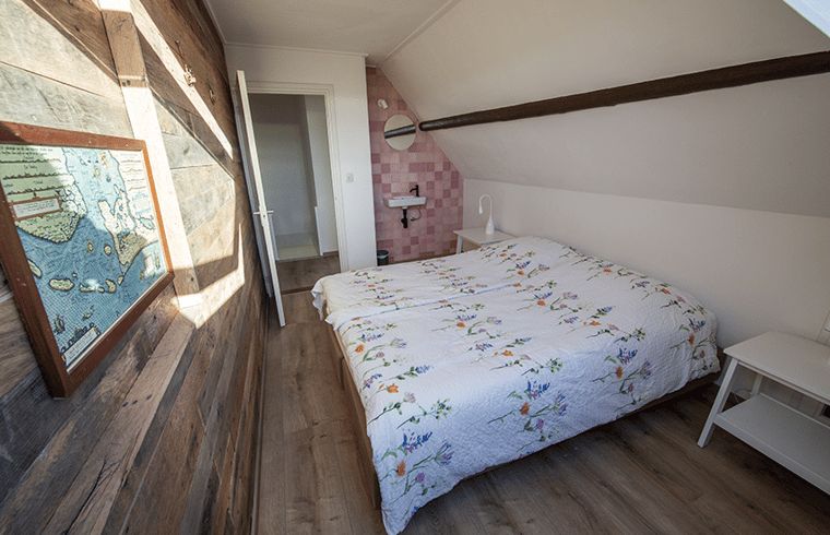 Bedroom with sky window in Holiday home in Oosterend, Texel. Cozy vacation home on the Wadden Islands.