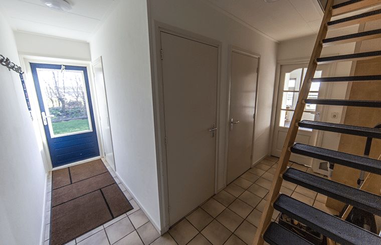 Hall with stairs in Holiday home in Oosterend, Texel. Spacious vacation home on the Wadden Islands.