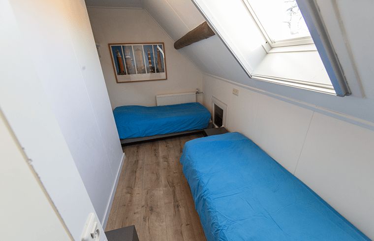 Second bedroom in Holiday home in Oosterend, Texel. Cozy vacation home with two beds on the Wadden Islands.