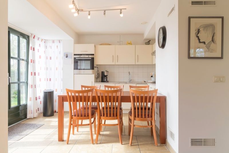 Kitchen and dining area in Type III - No. 21B Pheasant, Oosterend, Texel with modern amenities.