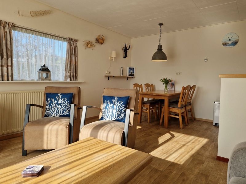 Spacious dining room in Bungalowpark Uterste Coogh - Bungalow 116, De Dennen, Texel, ideal for cozy dinners.