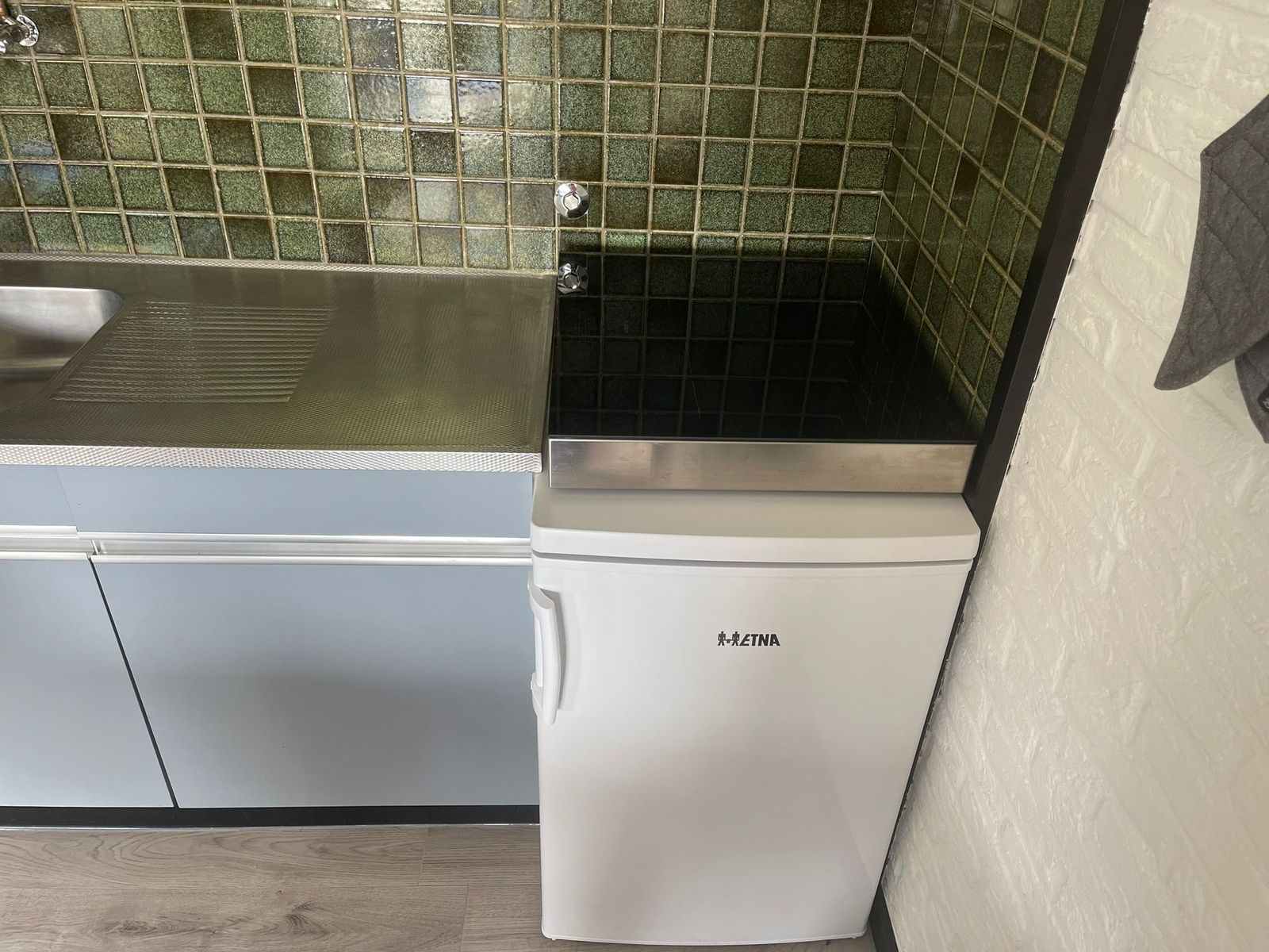 Compact refrigerator in the kitchen of Wollewei vacation home, De Dennen, Texel.