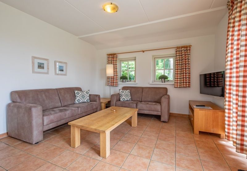 Cozy sitting area in 't Mienthuis - De Jonker, vacation home on Texel, De Dennen, ideal for a relaxing stay on the Wadden Islands.