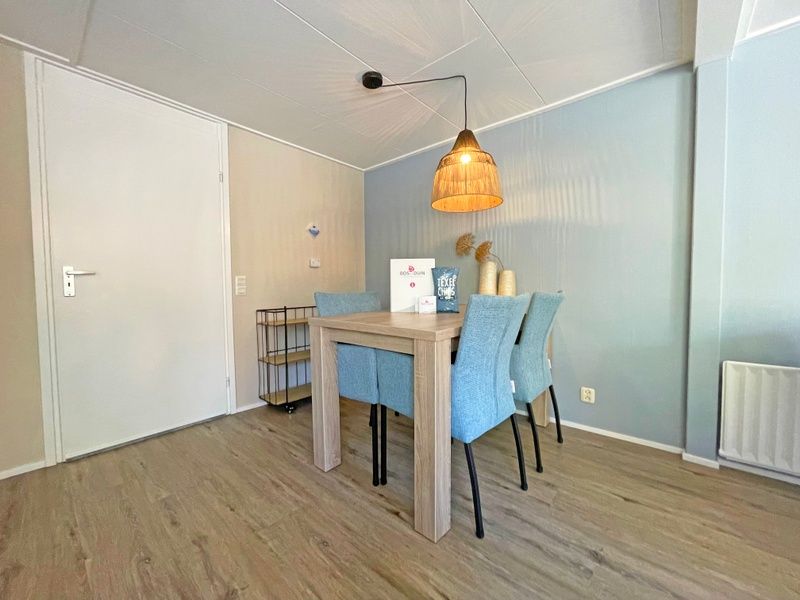 Modern kitchen in Apartment Bos en Duin 22, De Dennen, Texel with sleek cabinets and appliances.