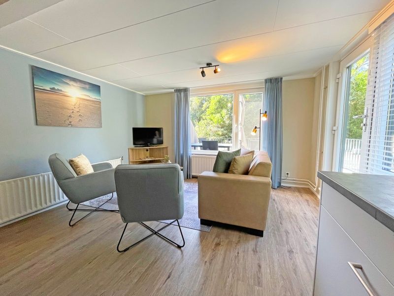 Attractive bedroom in Apartment Bos en Duin 22, De Dennen, Texel with double bed and nature view.