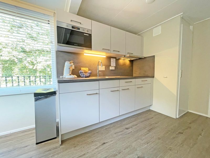 Comfortable bedroom in Apartment Bos en Duin 22, De Dennen, Texel with two single beds.