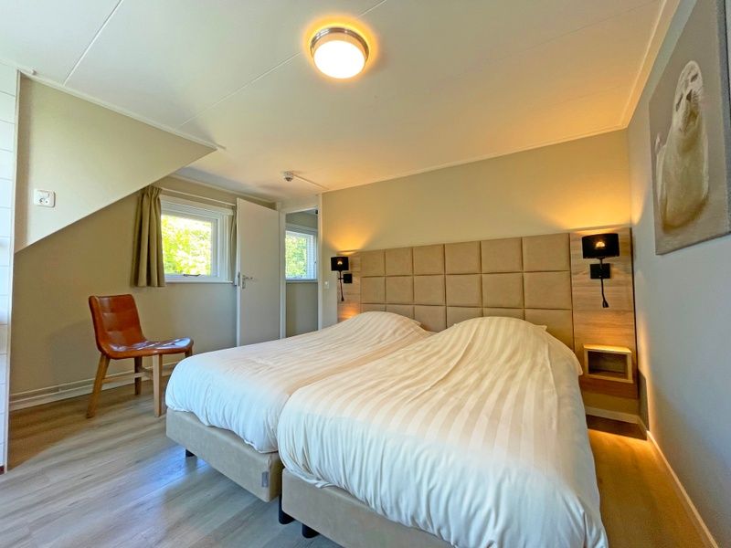 Stylish bathroom in Apartment Bos en Duin 22, De Dennen, Texel with shower and modern amenities.