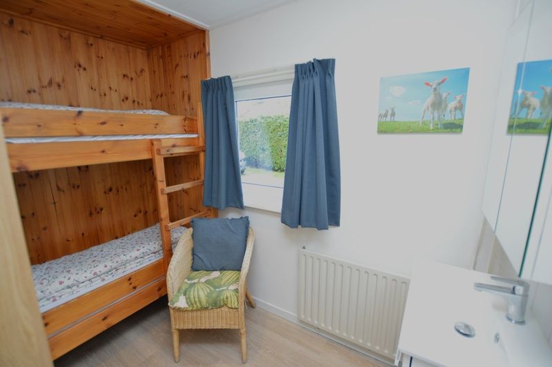 Bedroom with bunk beds in Holiday home de Parel 258, Texel, perfect for children.