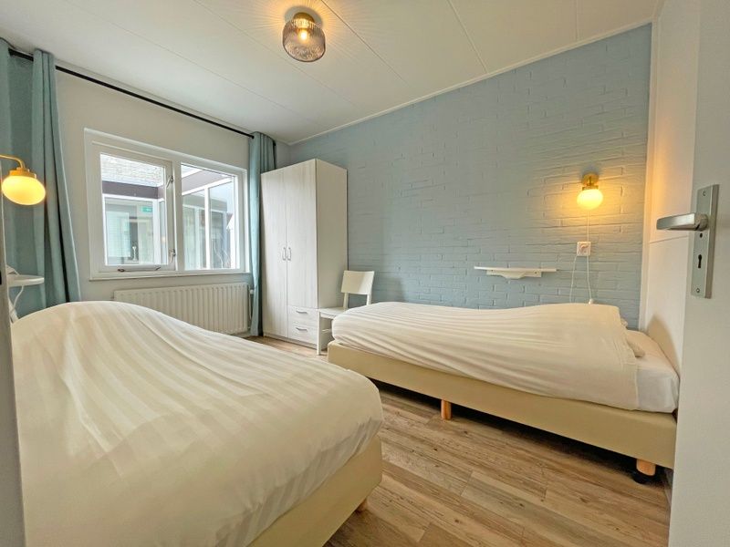 Spacious bathroom in Apartment Bos en Duin 27, De Dennen, Texel with modern amenities and sleek finishes.