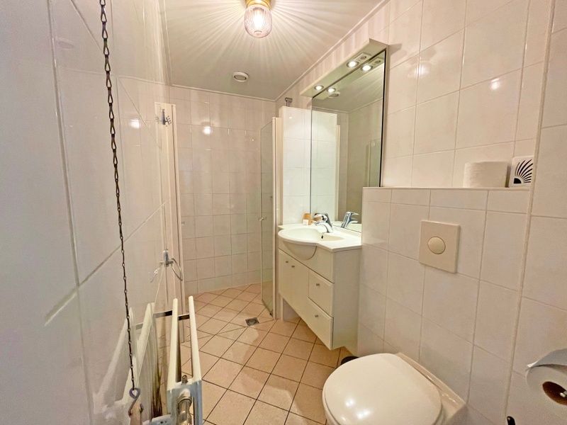 Balcony of Apartment Bos en Duin 27, De Dennen, Texel with beautiful views of the surroundings and comfortable seating.