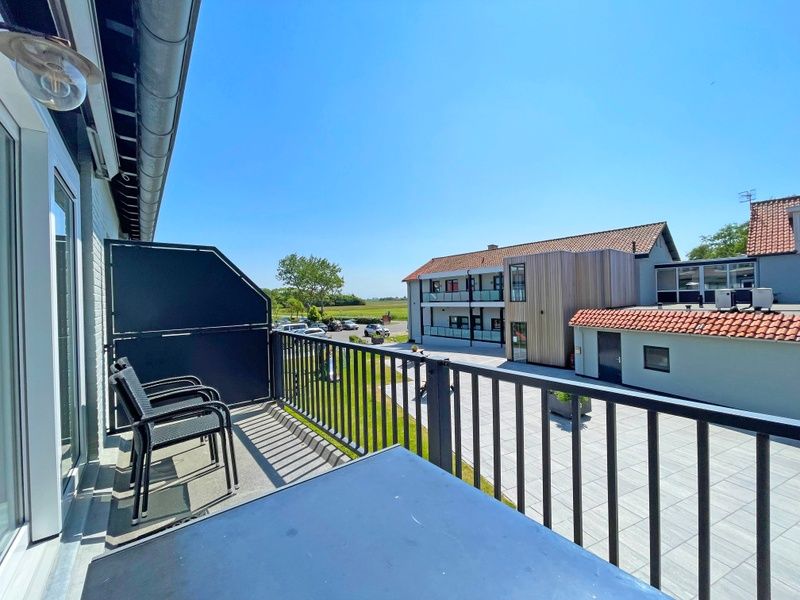 Exterior view of Apartment Bos en Duin 27, De Dennen, Texel located in a green and quiet area.