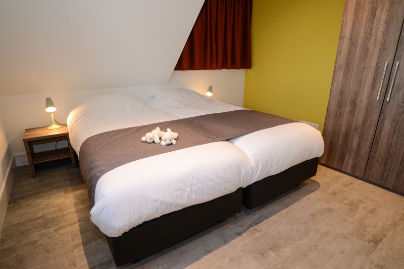 Comfortabele slaapkamer in vakantiehuis Bungalowpark 't Hoogelandt - De Zandkes, De Dennen, Texel.
