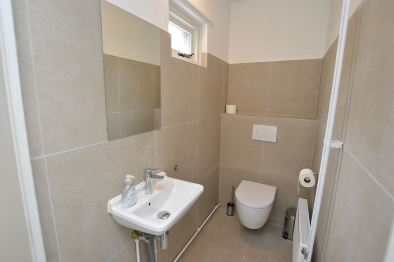 Komfortables Schlafzimmer im Bungalow 't Hoogelandt 24, De Dennen, Texel mit zwei Einzelbetten und ruhiger Atmosphaere.