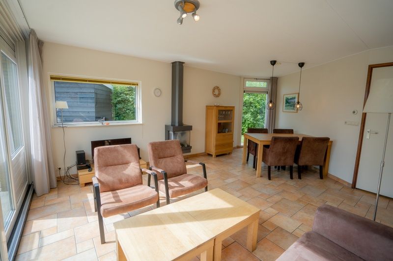 Spacious living space in Bungalow Uterste Coogh 98, De Dennen, Texel with modern furnishings.