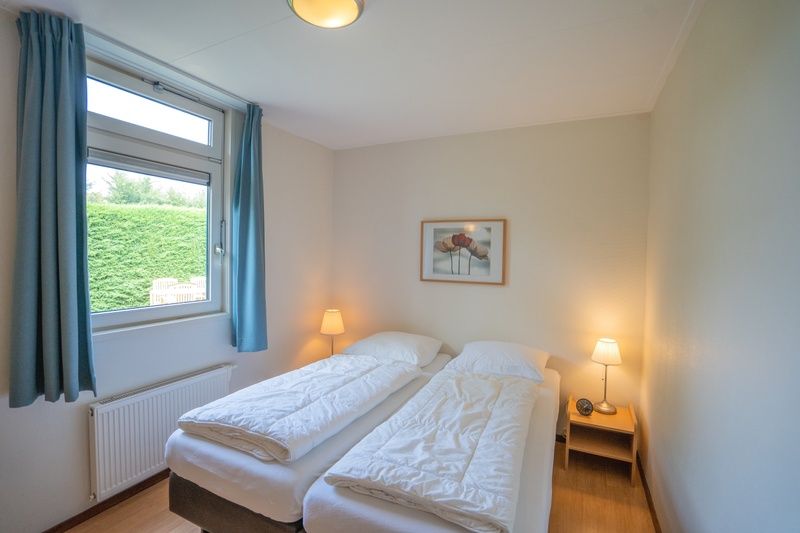 Comfortable bedroom in Bungalow Uterste Coogh 98, De Dennen, Texel with double bed.