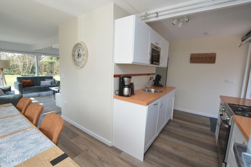 Functional kitchen in Bungalow Verste Coogh 58, De Dennen, Texel with modern appliances.