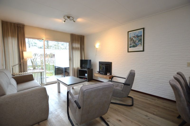 Cozy living room of Holiday home de Parel 196, Texel, with comfortable seating.