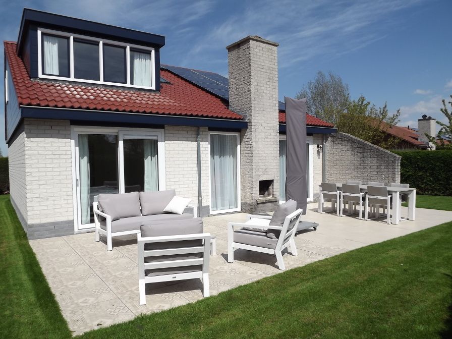 Enjoy the spacious garden with terrace at Holiday home Gortersmient 350 in De Dennen, Texel.