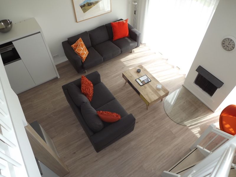 Cozy living room of Holiday home Gortersmient 350 in De Dennen, Texel, with comfortable seating area.