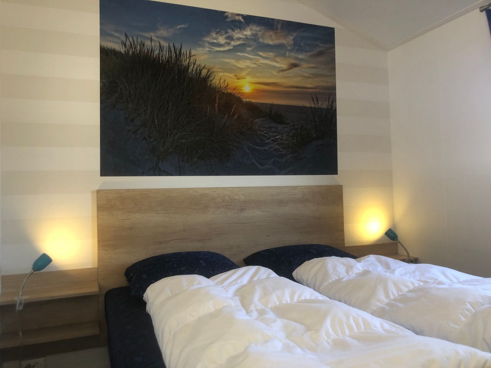 Bedroom with artwork in Vakantiepark de Bremakker, De Dennen, Texel.