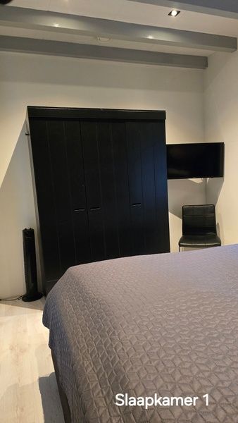 Comfortable bedroom in Helianthus vacation home, De Dennen, Texel with closet.